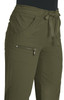 An olive green pant featuring a drawstring waist and multiple pockets, including a zippered side pocket.