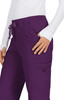 A pair of purple pants with a drawstring waist and pockets, featuring a logo on the side.