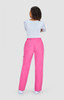 A pair of pink pants with a relaxed fit and pockets, viewed from the back, worn with a white top.