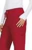 A pair of red pants featuring a drawstring waist and side pockets, displayed on a model wearing a white top.