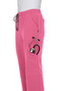 A pair of pink jogger pants with pockets and a stethoscope visible in one pocket. 