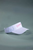 A white sun visor with a pink logo on the front, featuring a curved brim and adjustable strap.