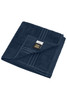 A navy hand towel with a fold and stitched detailing, featuring a branding label.