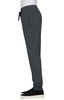 A grey jogger pant with an elastic waistband and pockets, featuring a logo on the leg.