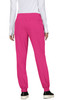 A woman wearing bright pink jogger pants with an elastic waistband and pockets, viewed from the back.
