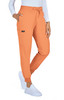 An orange jogger pant with a drawstring waist and side pockets, styled with a white long-sleeve top and white shoes.