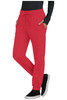 A red pair of jogger pants with pockets and a drawstring waist, styled with a black long-sleeve top and black shoes.