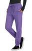 A pair of purple jogger pants with pockets, featuring an elastic waistband and cuffs, alongside a black top and shoes.