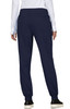 A pair of navy jogger pants with an elastic waistband and pockets, viewed from the back. The model is wearing a white long-sleeve top.