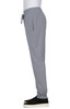 A grey jogger pant with an elastic waistband, side pockets, and a drawstring detail. It has a logo visible.