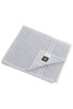 A grey bath towel with a folded edge and a small logo tag. It features subtle striped detailing.