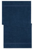 A navy blue bath towel with a textured finish and two horizontal stripes. It features a logo or branding.