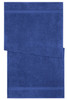 A blue bath towel with a textured design and two horizontal stripes. It features a logo.