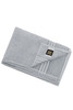 A folded grey bath sheet with a decorative stripe and a logo tag. Soft texture visible.