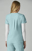 A dress top in light blue with a pleated back, featuring a small logo on the upper section.
