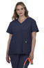A navy blue medical scrub top with a V-neck and two front pockets, featuring a logo on the sleeve.