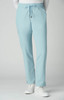 Atria Pant in light blue, featuring a drawstring waist and a side pocket. The model is wearing white shoes.