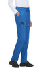 Atria Pant in blue, featuring pockets and a drawstring waist, displayed on a model wearing a white top and shoes.