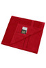 A red hand towel with a textured surface and a pocket on one side. The towel has a branding label.