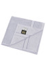 A light grey hand towel neatly folded, featuring a stitched edge and a logo on the tag.