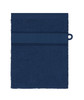 A navy blue flannel hand towel with a textured stripe detail and a loop for hanging. It features a logo.