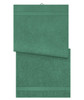 A green bath towel with a textured surface and a hanging loop. It has a simple design and includes a logo.