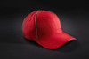 A red six-panel cap with contrasting trim and a logo. Ideal for workwear or casual wear.