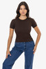 A brown baby rib tee is displayed on a model, paired with blue jeans and set against a plain background.
