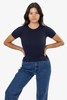 A navy blue baby rib tee is displayed on a model, paired with high-waisted denim jeans. The shirt has a fitted silhouette and short sleeves.