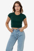 A model wears a fitted dark green cap sleeve crop top paired with high-waisted light blue jeans.