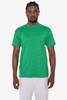A green short sleeve cotton-poly t-shirt with a logo, displayed on a model in casual wear.