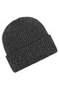 A reflective black winter beanie with a textured knit pattern and a cuffed design. It features branding.
