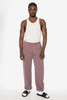 Heavy fleece sweatpants in mauve, styled with a white tank top and black sandals, featuring an elastic waistband.