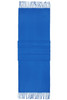 A blue elegant scarf with fringed edges and three textured folds at the centre. It features a logo on the fabric.