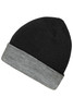 A reversible beanie in black with a grey cuff. It features a logo on one side.