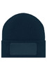 A knitted navy blue beanie featuring a patch area for custom branding or decoration.