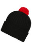 A black knitted beanie with a red pompon on top and a ribbed texture. It features a logo on the side.