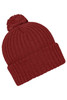 A knitted beanie in a rich red colour with a fluffy pompon on top. Features a ribbed texture and folded cuff.