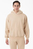 A beige heavy fleece hooded pullover displayed on a model, featuring a front pocket and a logo.
