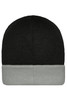 A knitted beanie featuring a black top and a grey cuff, with a logo on the side.