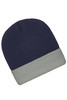 A knitted beanie featuring a navy blue top and a grey folded cuff, with a logo on the side.
