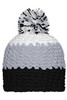 A beanie with a pompon, featuring grey, white, and black colours. The beanie has a textured pattern and a round pompon on top.