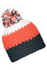 A beanie in orange, white, and dark grey with a pompon on top. It features a logo on one side.
