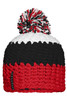 A beanie with a pompon featuring red, black, and white stripes, and a branding label on the side.