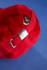 A red 5 panel cap featuring a metal adjustment buckle on the back and a logo inside.
