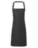 A dark denim bib apron with adjustable straps and three front pockets. Features a logo on the apron.