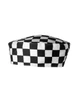 A chef's skull cap featuring a black and white checkered pattern. It has a rounded shape and is made from fabric.
