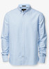 A light blue button-up shirt with a collar and long sleeves, featuring branding on the inside.
