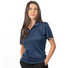 A navy blue polyester sport shirt featuring a collar and a logo, modelled by a woman.