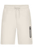 Light-coloured men's interlock shorts featuring an elastic waistband and side pocket with a logo.